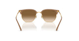 The Ray-Ban NEW CLUBMASTER RB4416F sunglasses feature brown gradient lenses and gold frames, reflecting light on a white surface.