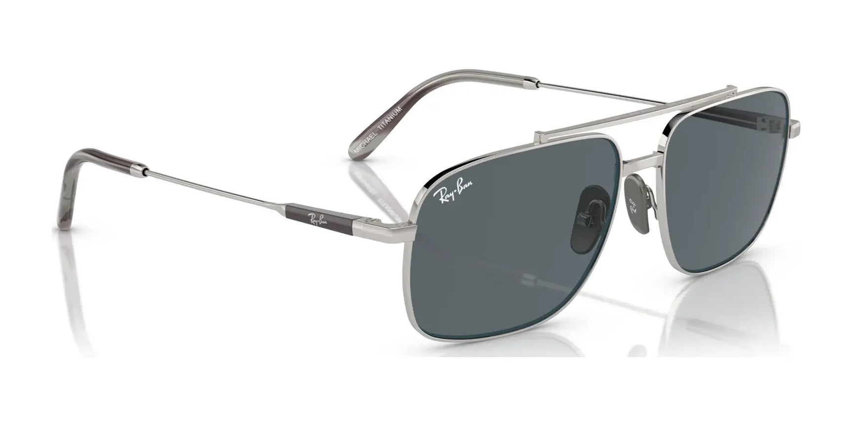 The Ray-Ban MICHAEL TITANIUM RB8096 sunglasses feature a sleek silver titanium frame with dark lenses that offer UV protection and chic thin arms.