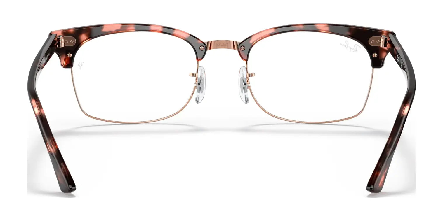 The Ray-Ban CLUBMASTER SQUARE RX3916V eyeglasses feature a tortoiseshell design with a modern Clubmaster Square style, including a thin metal bridge and clear nose pads for a contemporary front view. Available in size 52 from the renowned brand, Ray-Ban.