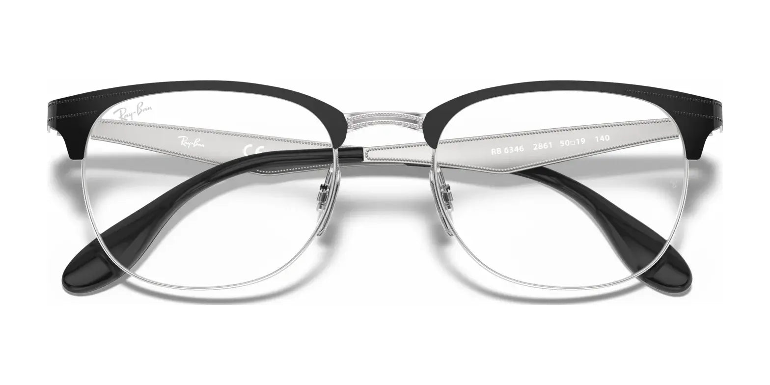 The Ray-Ban RX6346 Eyeglasses in black and silver boast a sleek semi-rimless design with adjustable nosepads, providing crystal-clear vision through their clear lenses, and are available in size 52.