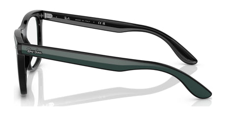 The Ray-Ban RX7209 Eyeglasses, featuring black frames and green temples in a size 55, present a luxurious eyewear experience and are ready for your prescription needs when viewed from the side.