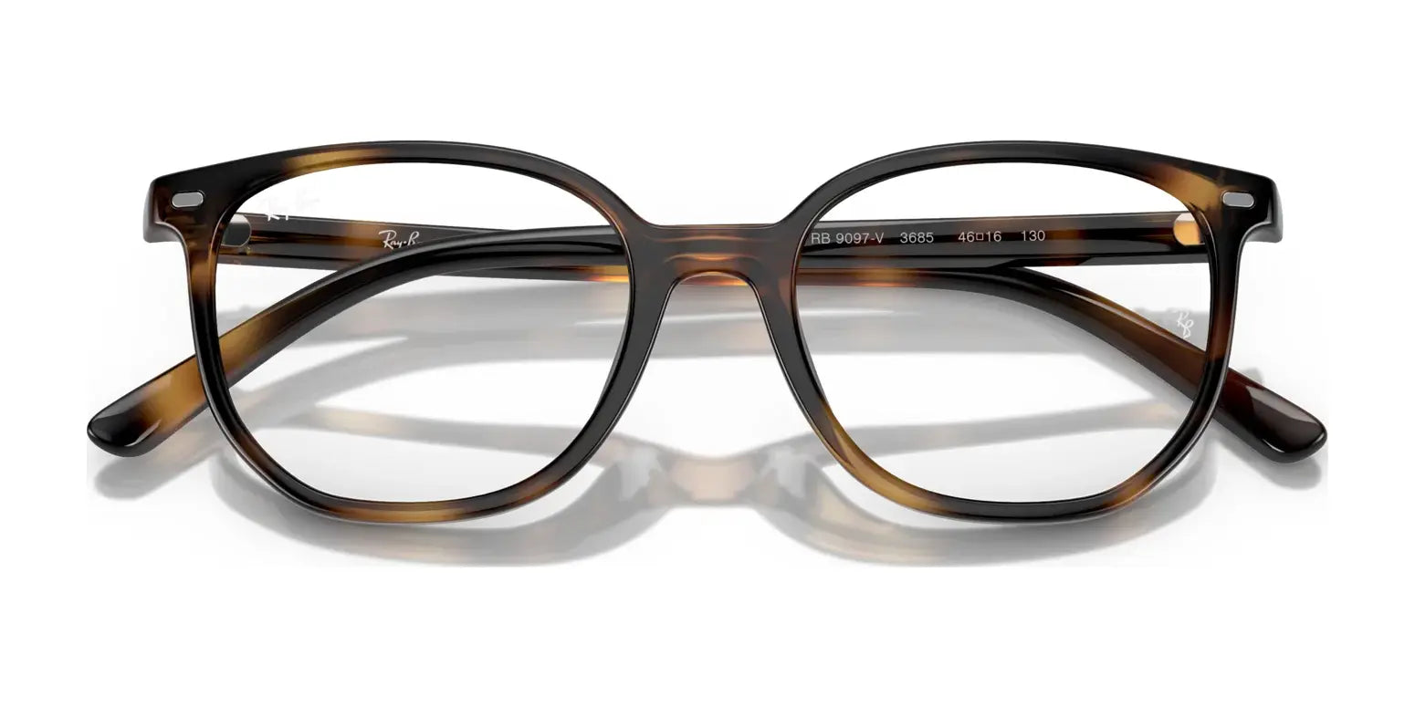 The Ray-Ban JUNIOR ELLIOT RY9097V eyeglasses, designed for kids, boast round lenses and prominent branding on the temples, providing a fashionable tortoiseshell option when seen from the front.