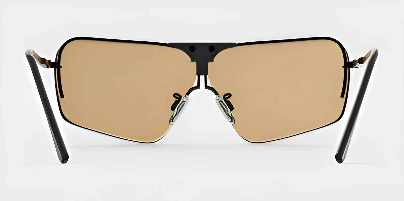 The RE Ranger Edge Shooting Glasses by RE Ranger showcase a wide rectangular design with angular lenses and a black frame, set against a plain background. These glasses combine style and optical performance, featuring amber-tinted lenses that enhance visual clarity and provide a custom fit for everyday wear.