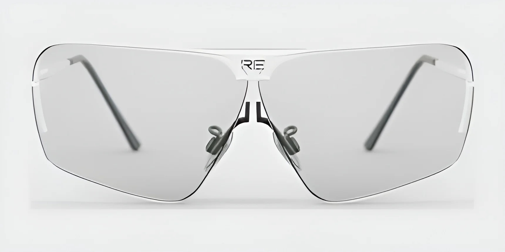 Introducing the RE Ranger Edge Shooting Glasses: elegant silver eyewear featuring angular lenses, slender arms, and a tailored fit designed to enhance optical performance.