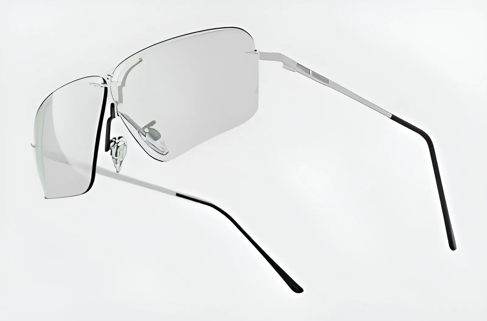 The RE Ranger Edge Shooting Glasses by RE Ranger feature sleek, frameless designs with angular lenses and thin, metal arms that ensure exceptional optical performance against a plain background.