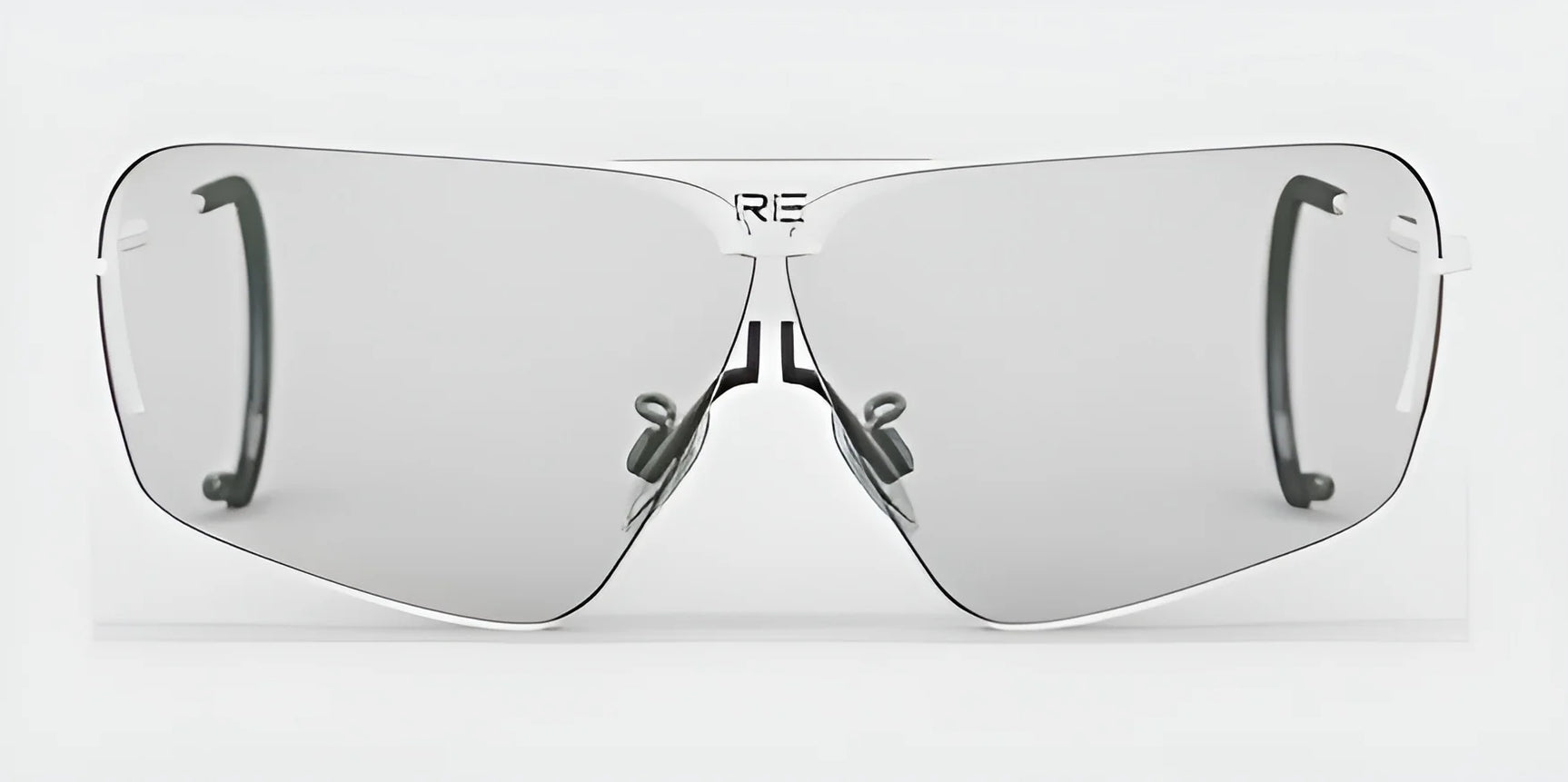 The RE Ranger Edge Shooting Glasses by RE Ranger showcase a futuristic design with oversized lenses, featuring an angular style and thin metallic frames that deliver superior optical performance against light backgrounds.