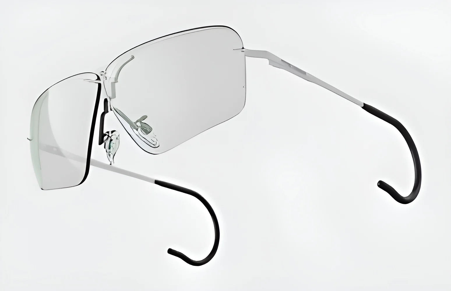 The RE Ranger Edge Shooting Glasses deliver exceptional optical performance with their minimalist frameless design and angular lenses. The metal arms and black ear tips ensure a custom fit, set against a sleek white background.