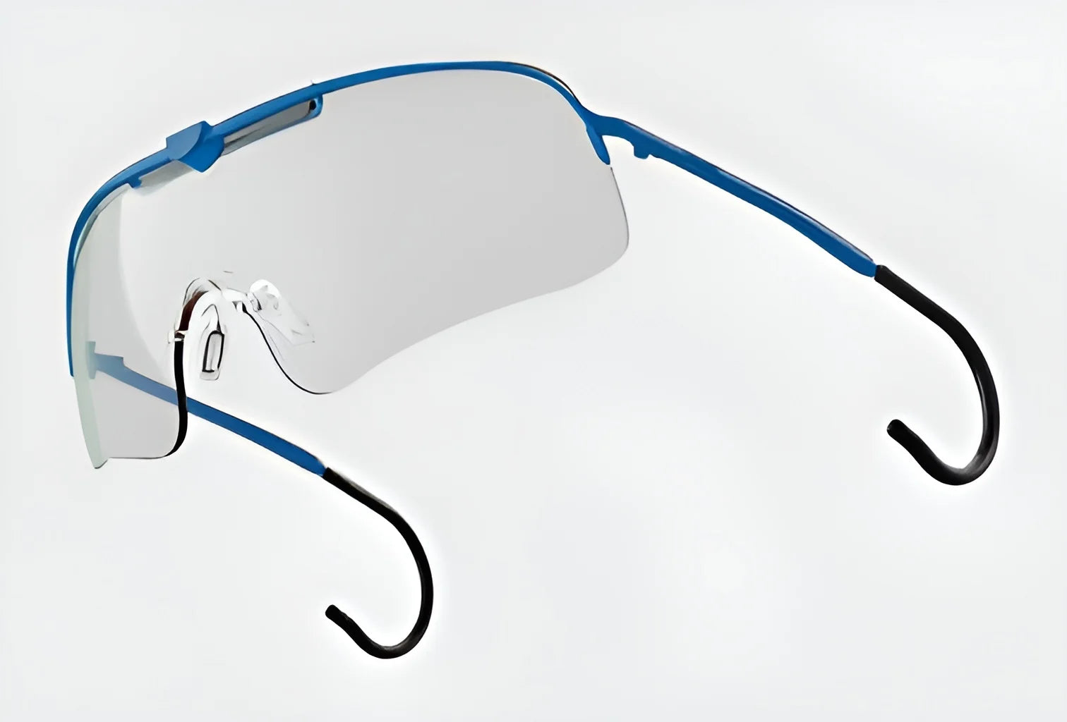 The RE Ranger Falcon Pro Shooting Glasses feature a minimalist design with blue and black rimless frames, aerodynamic lenses, and thin temples, all evoking the sleek style of shooting glasses against a light background.