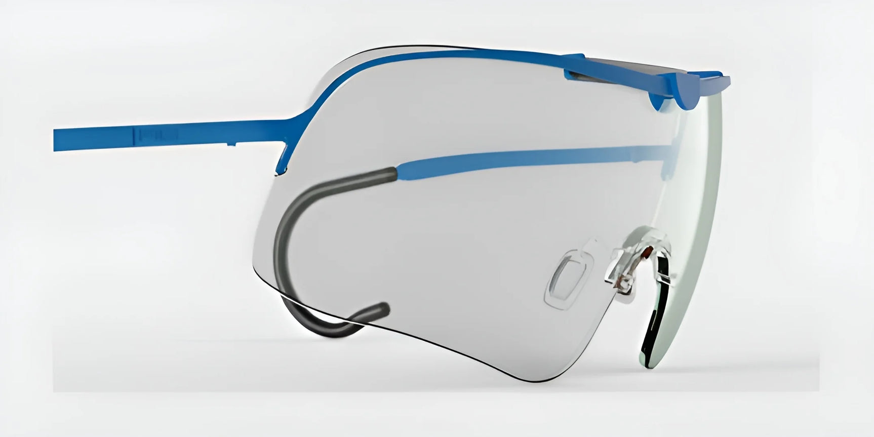 The RE Ranger Falcon Pro Shooting Glasses, by RE Ranger, are highlighted on a white background with their aerodynamic lenses and blue frames, transparent lenses, and minimalist design.