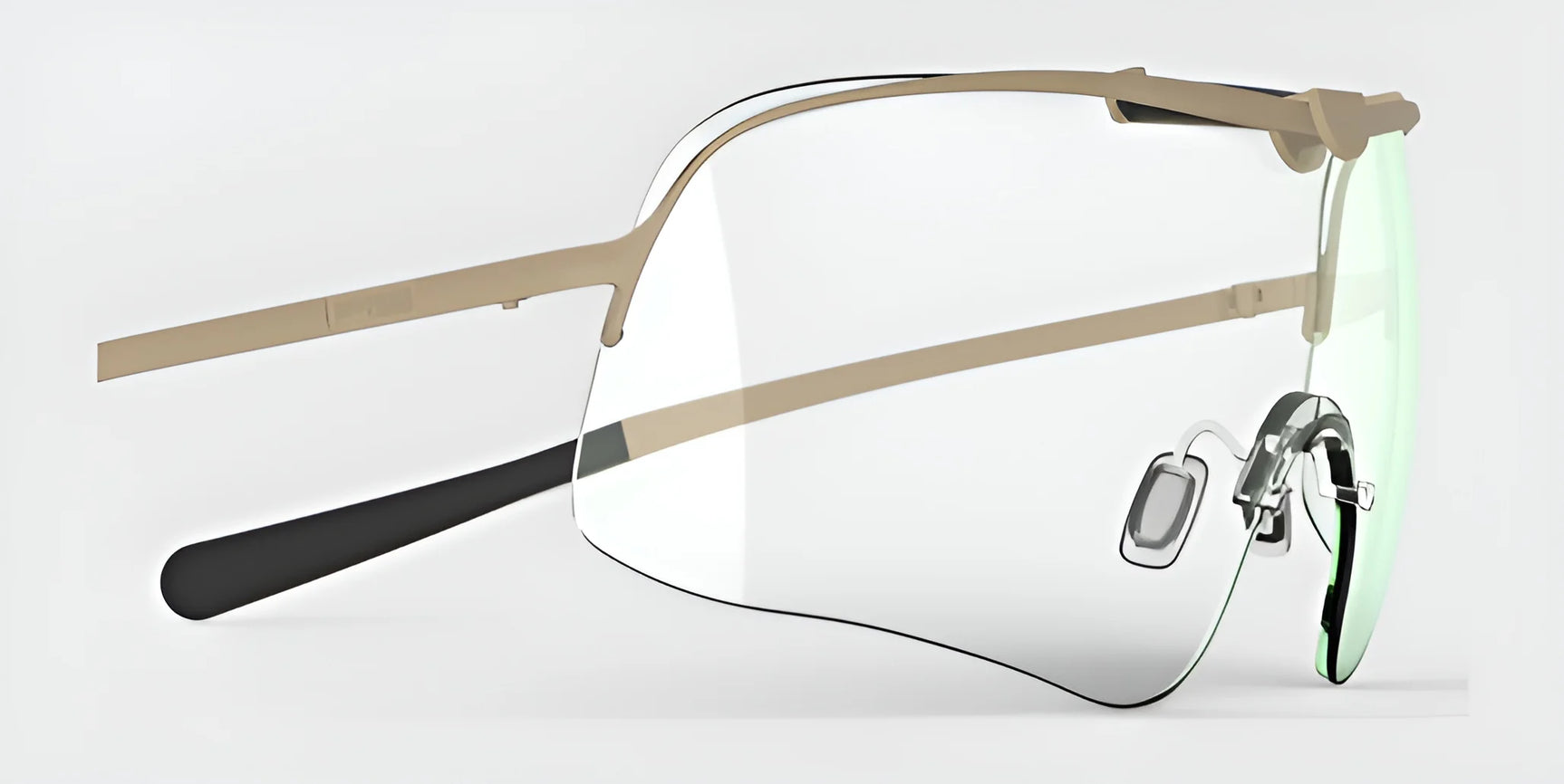 The RE Ranger Falcon Pro Shooting Glasses showcase a sleek, rimless design with a slim beige frame and aerodynamic lenses set against a gray backdrop.