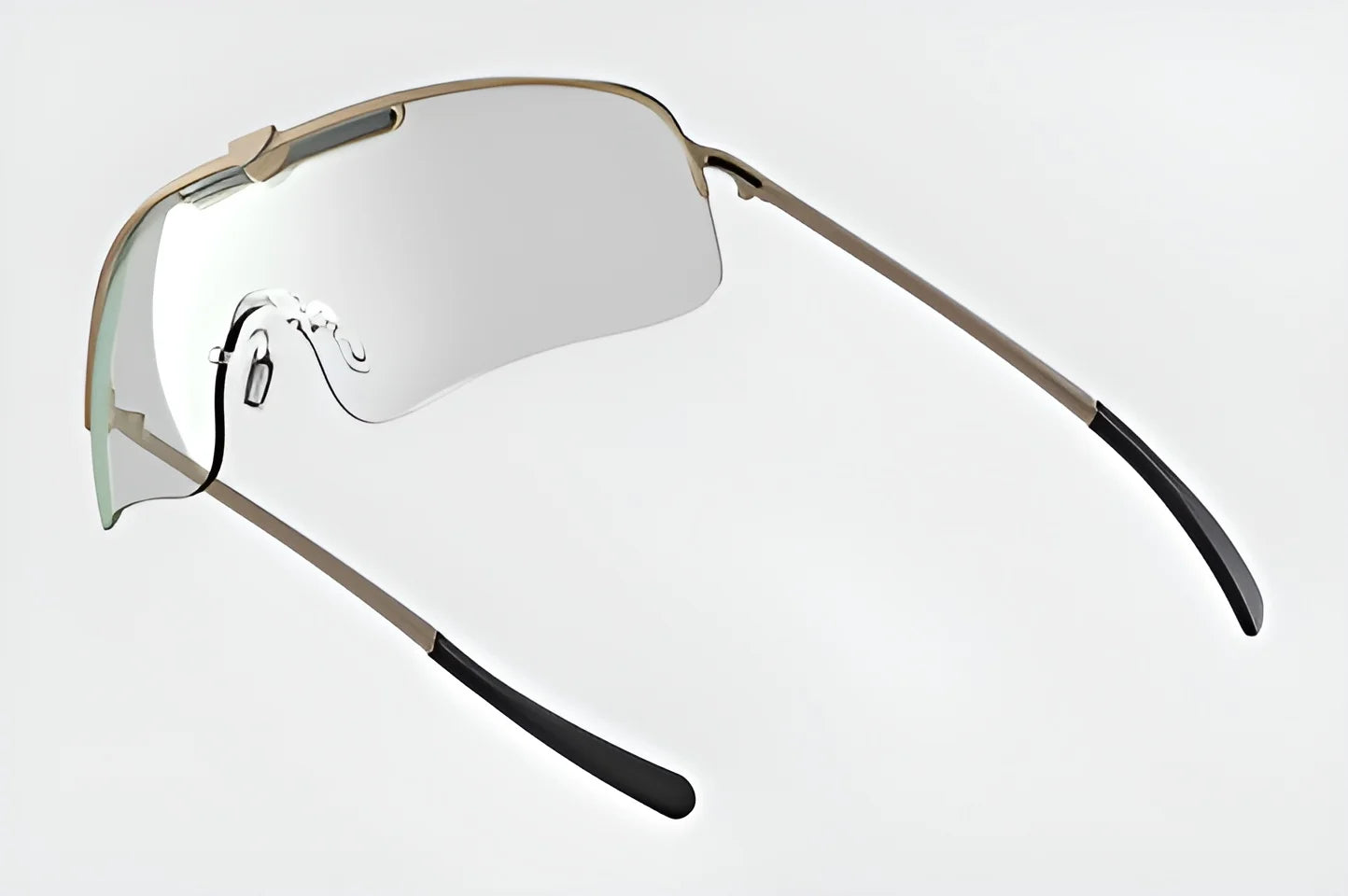 The RE Ranger Falcon Pro Shooting Glasses feature a sleek, frameless design with thin metal temples and black tips, set against a simple background. Their aerodynamic lens design adds a modern touch.