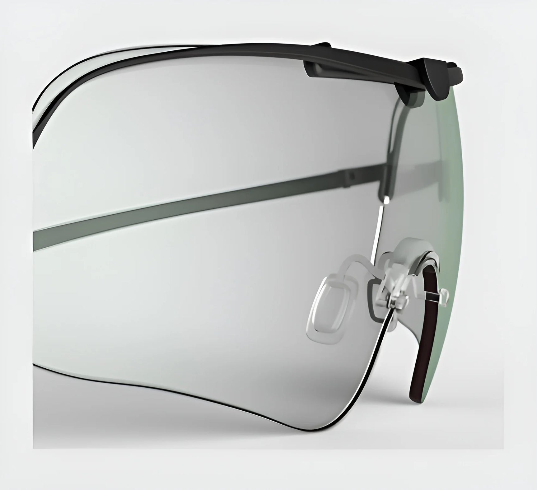 A close-up showcases the RE Ranger Falcon Pro Lens sunglasses, featuring a sleek black frame and gradient lenses. Perfectly designed for optimal vision during outdoor activities, these sunglasses are set against a light gray background and offer an ideal blend of style and performance by enhancing every detail.