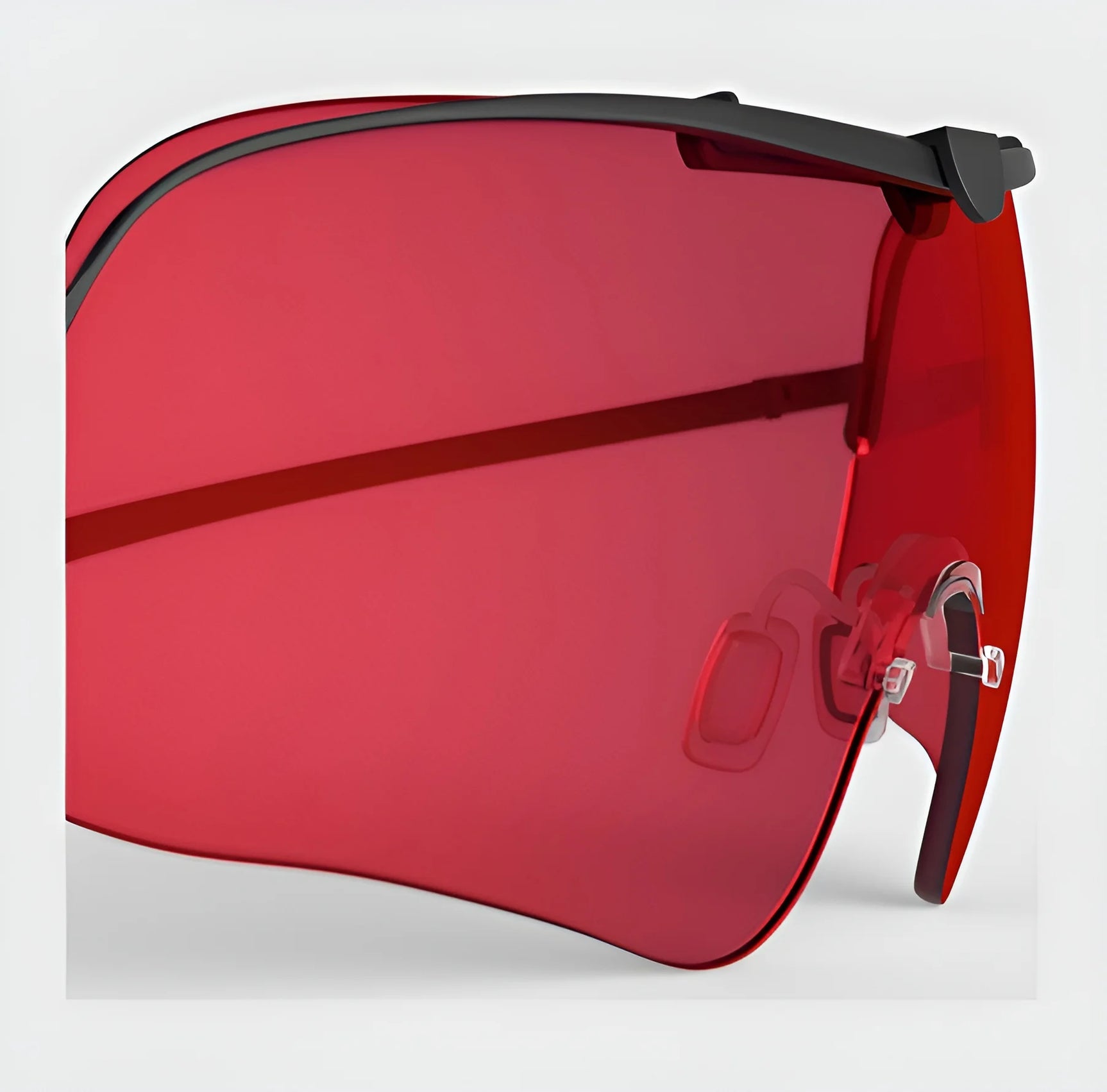 A close-up of wraparound sunglasses with a red frame, featuring the RE Ranger Falcon Pro Lens for optimal vision. They have transparent nose pads and black accents against a light background—ideal for outdoor activities.