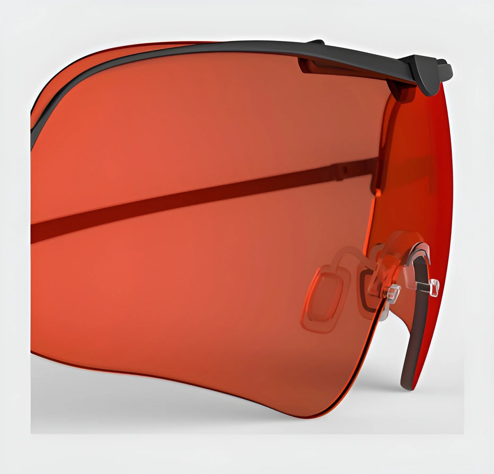 A close-up of the RE Ranger Falcon Pro Lens sunglasses featuring red-tinted lenses and a black frame, designed by RE Ranger for optimal vision during outdoor activities.