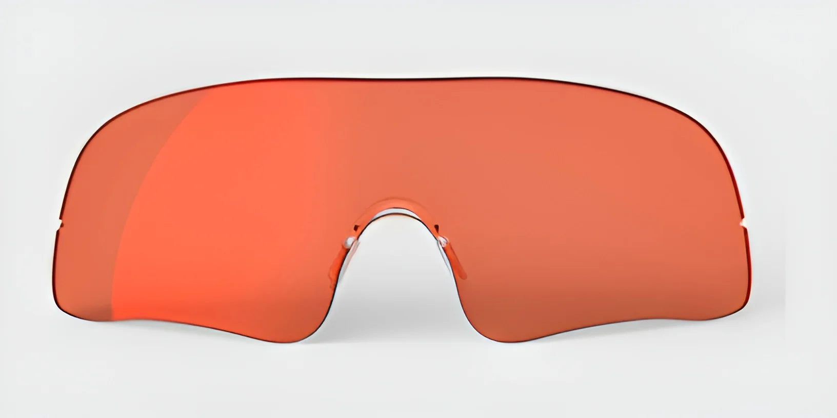 Introducing the RE Ranger Falcon Pro Lens sunglasses, boasting a sleek, futuristic design with orange-tinted lenses that provide optimal vision for outdoor activities. These stylish glasses feature a single large curved lens set against a clean white backdrop.