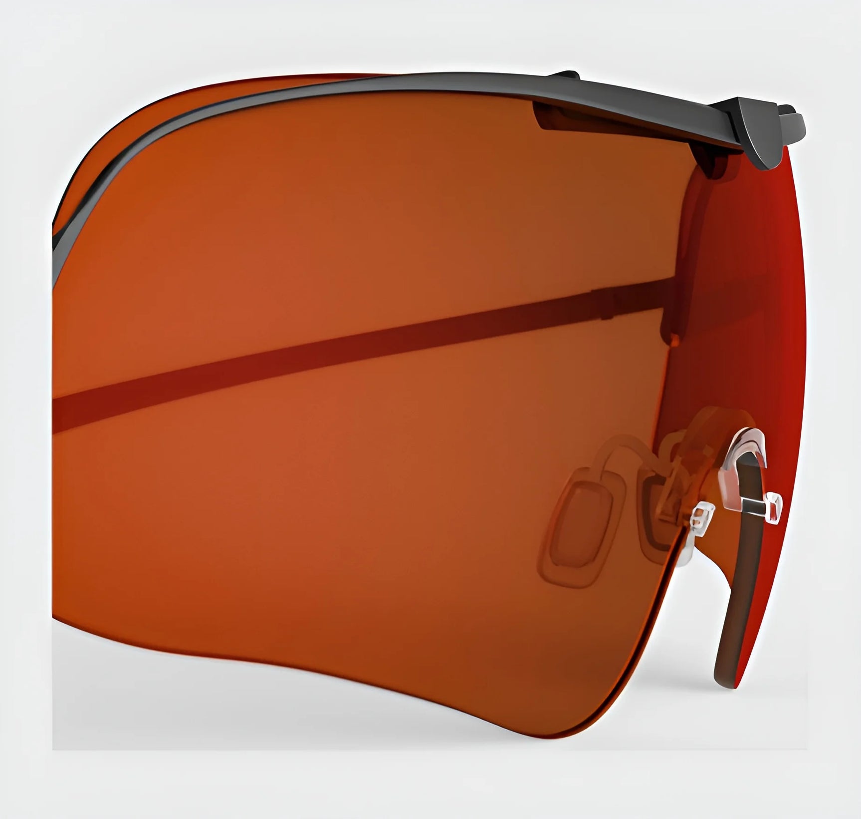 Close-up of the RE Ranger Falcon Pro Lens sunglasses by RE Ranger, featuring an oversized single lens with a red-orange tint and black rim, set against a gray background. These sunglasses are designed to deliver optimal vision during outdoor activities.