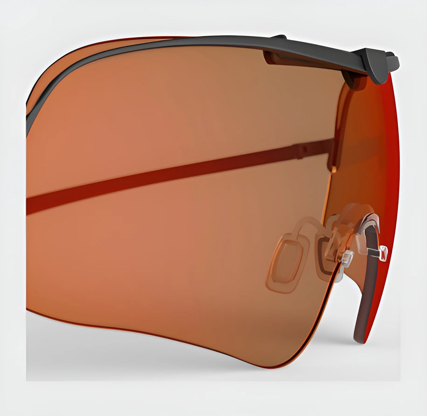 Close-up of oversized sunglasses with an orange tint, featuring a sleek black frame and nose pads. These are designed specifically for outdoor activities to provide optimal vision and are perfectly complemented by the RE Ranger Falcon Pro Lens from RE Ranger.