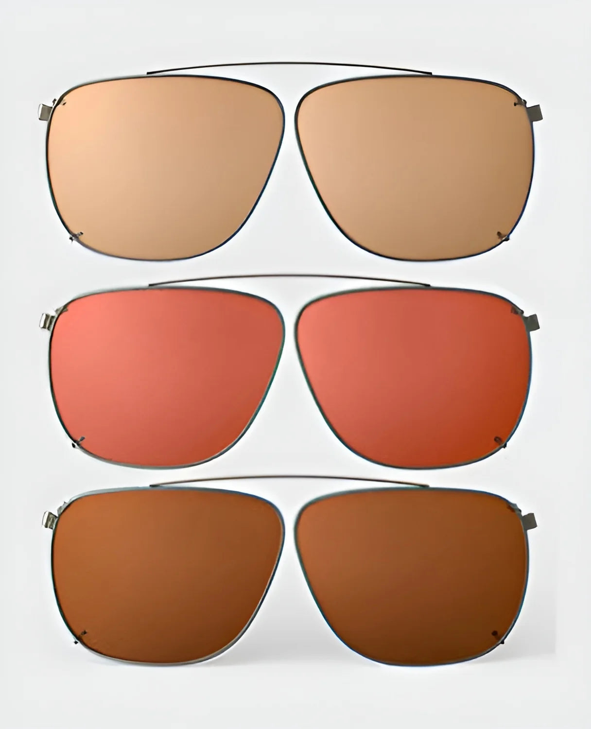 Three pairs of RE Ranger Sporter clip-on sunglasses with different colored lenses—light brown, red, and dark brown—on a white background. Ideal for enhancing your shooting skills, these RE Ranger clip-on lenses offer both style and functionality.