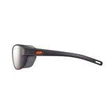 Side view of Julbo Camino Sunglasses in sleek black with mirrored, photochromic lenses and an orange logo on the temple, size 58.