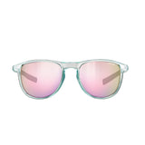 The Julbo Canyon Sunglasses | Size 51, featuring clear frames with an ergonomic design and pink-tinted lenses, elegantly contrast a white background.