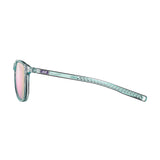 Side view of Julbo Canyon Sunglasses, Size 51, featuring a transparent frame with pink-tinted lenses and decorative arm design for an ergonomic touch, set against a white background.