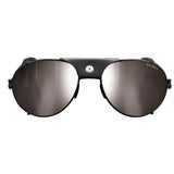 The Julbo Cham Sunglasses (Size 58) embody alpine classic eyewear with reflective brown aviator lenses, highlighted by a black leather bridge and a small silver button on top.