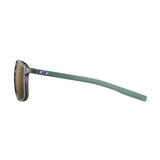 Side view of Julbo Creek Sunglasses, size 52, with green arms, transparent lightweight frames featuring a small logo and Spectron HD lenses for enhanced clarity.