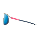 Side view of Julbo Density Sunglasses, featuring blue lenses, a clear frame, pink-blue arms, sleek design, and CustomFit Temples for an ideal fit.