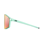 Side view of the Julbo Edge sunglasses by Julbo in mint green, showcasing orange-tinted lenses and black end tips. They feature a small logo on the arm and MagneFix technology for optimal comfort and performance.