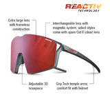 The Julbo Edge Sunglasses by Julbo feature red frameless lenses, an adjustable nosepiece, and grip tech arms. They incorporate MagneFix technology for easy lens swaps and have an anti-fog coating. The package includes interchangeable lenses.