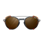 Julbo Legacy Sunglasses Size 51 feature black-framed, round brown lenses with red accents and adjustable slim temples, viewed from the front.