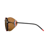 Side view of Julbo Legacy Sunglasses (Size 51) in black, showcasing brown leather side shields and adjustable slim temples with red tips.