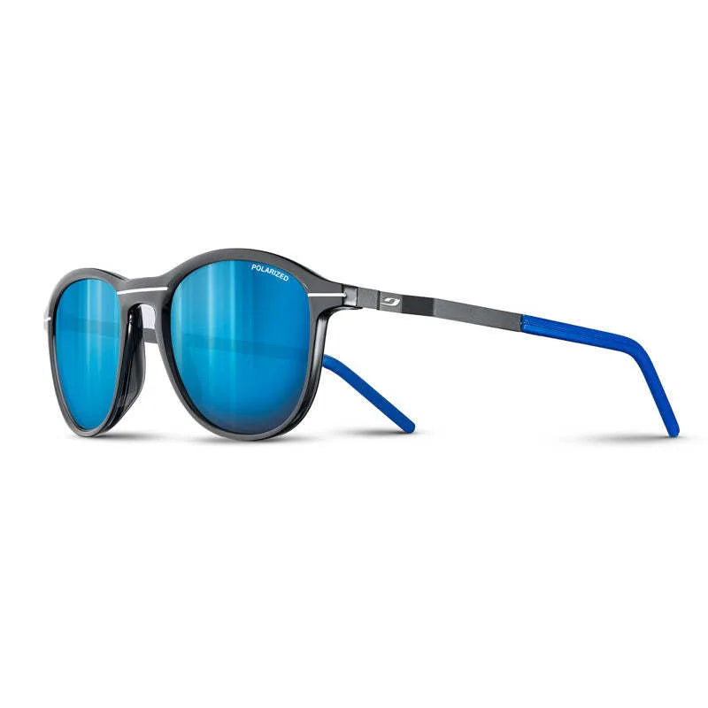 The Julbo Link Sunglasses, Size 52, feature sleek black translucent frames with blue mirrored polarized lenses and blue earpieces. Grip Tech temples ensure a secure fit, elegantly displayed on a white background.