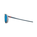The Julbo Meta Sunglasses in size 55 boast a sleek side view with gray frames, blue lenses, and long thin arms featuring a red logo. Designed for an urban look, they include Grip Tech technology to ensure comfort and stability.