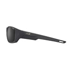 A side view of the ergonomic, rectangular Julbo Rookie 2 Sunglasses in sleek black highlighting REACTIV lenses for superior clarity and adaptability against a white background. Size: 58.