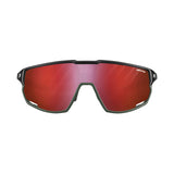 Julbo Rush Sunglasses feature a sleek black frame and reflective red lenses on a white background. Offering adjustable temples for a perfect fit, these stylish sunglasses by Julbo ensure comfort and performance during every ride.