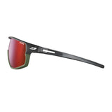 The Julbo Rush Sunglasses by Julbo feature photochromic red lenses that adapt to light, a sleek black and green frame with a side view, and adjustable temples for a custom fit—ideal for any outdoor adventure.