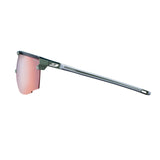 The Julbo Ultimate Sunglasses by Julbo feature a sleek design with a thin green frame and orange reflective panoramic lens, ensuring a secure fit for optimal freedom in sports.