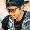 Enjoy ultimate freedom in sport with a secure-fit cap and Julbo's Ultimate Sunglasses. These reflective sunglasses, featuring a panoramic lens, provide the perfect look while gazing downward outdoors.