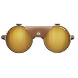 The Julbo Vermont Classic Sunglasses, Size 51, feature gold mirrored lenses and a brown leather bridge for a stylish nod to traditional mountaineering glasses.