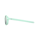 Side view of Julbo Walk Sunglasses in mint green for kids, featuring round Spectron lenses and a durable arm with a hole at the end. Size 39.